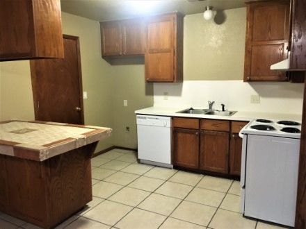 A kitchen with a tile floor