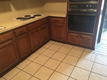 A stove top oven sitting inside of a kitchen