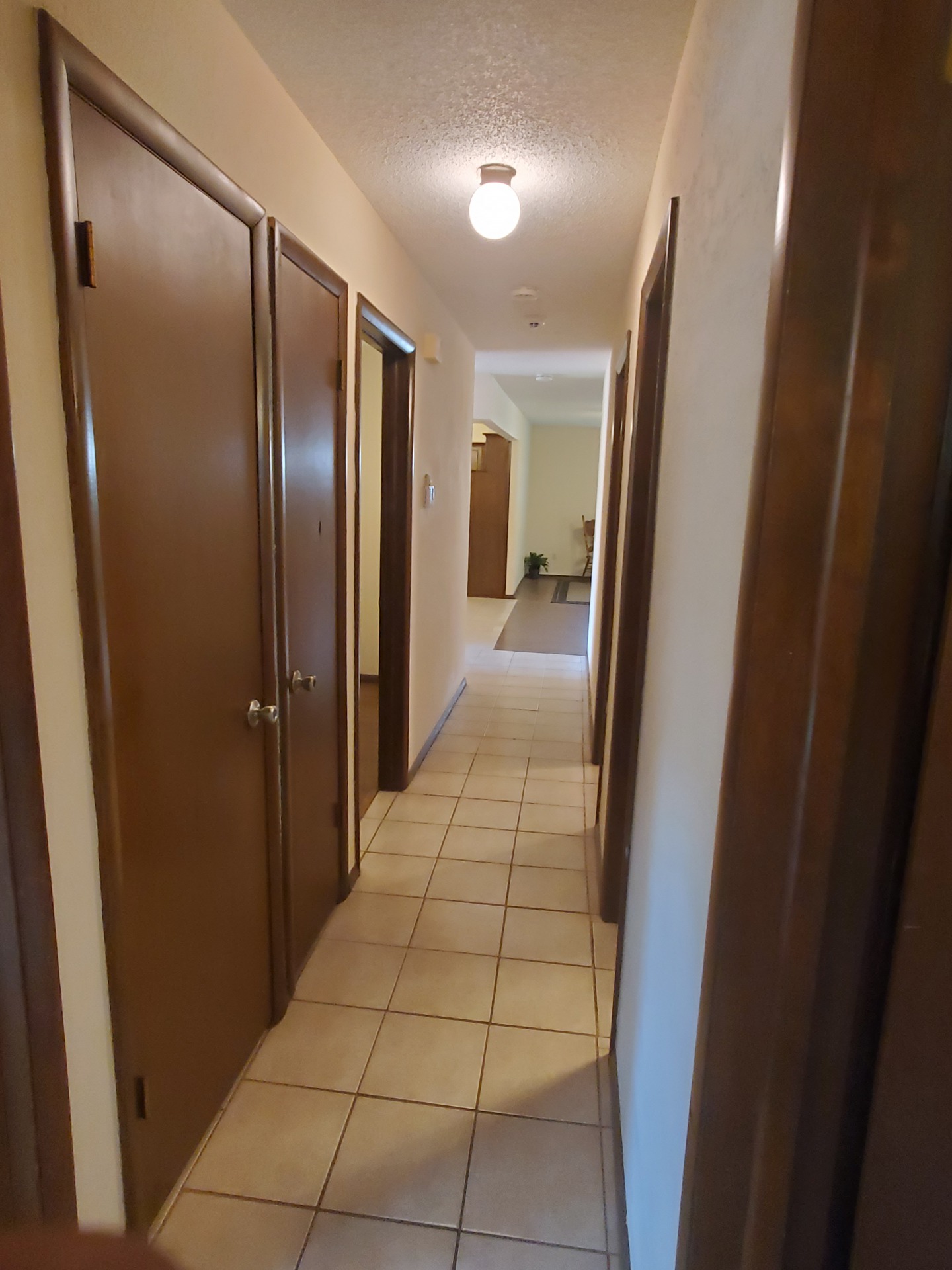 A view of a tiled floor next to a door