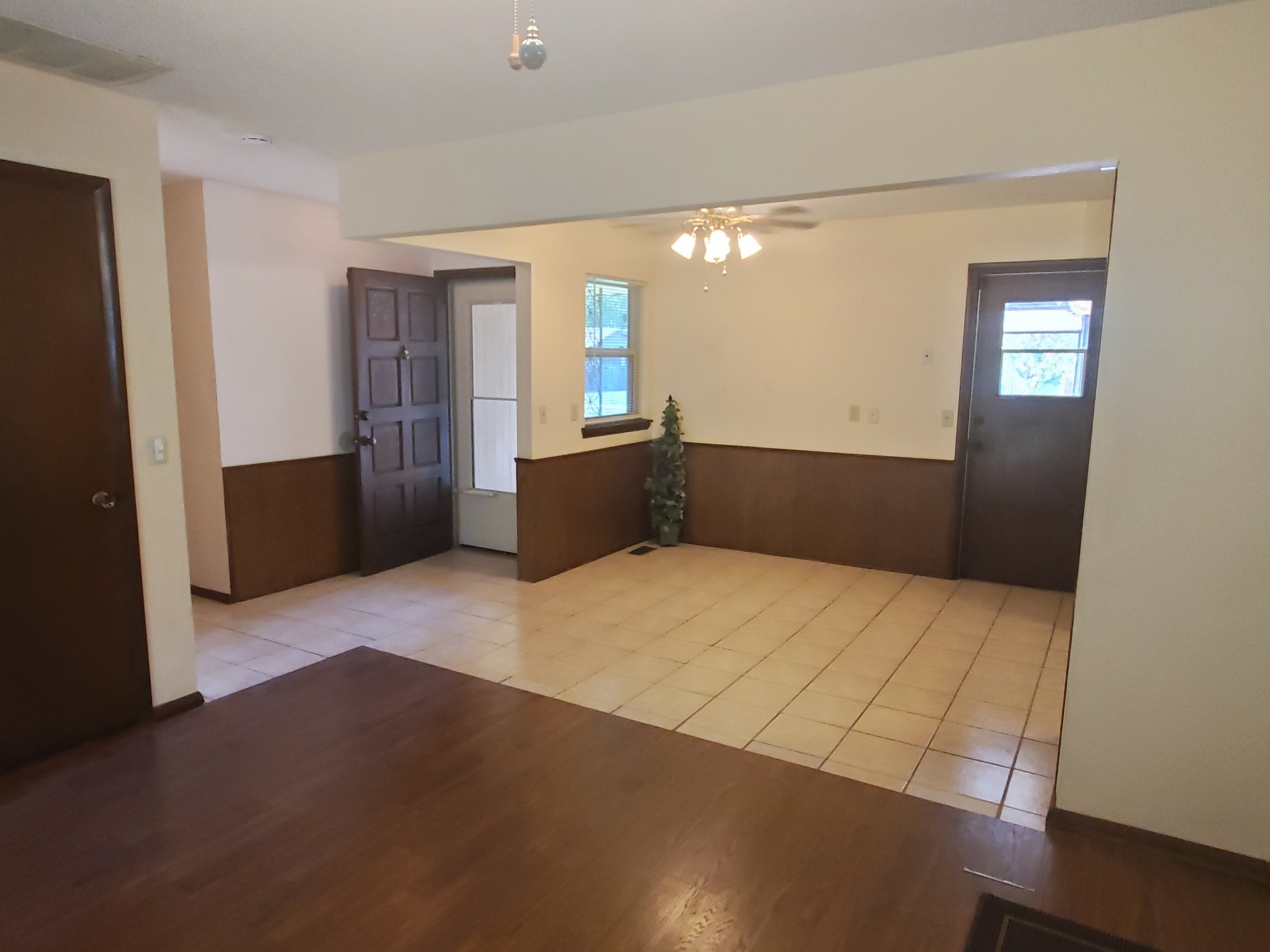 A large living room with a wood floor