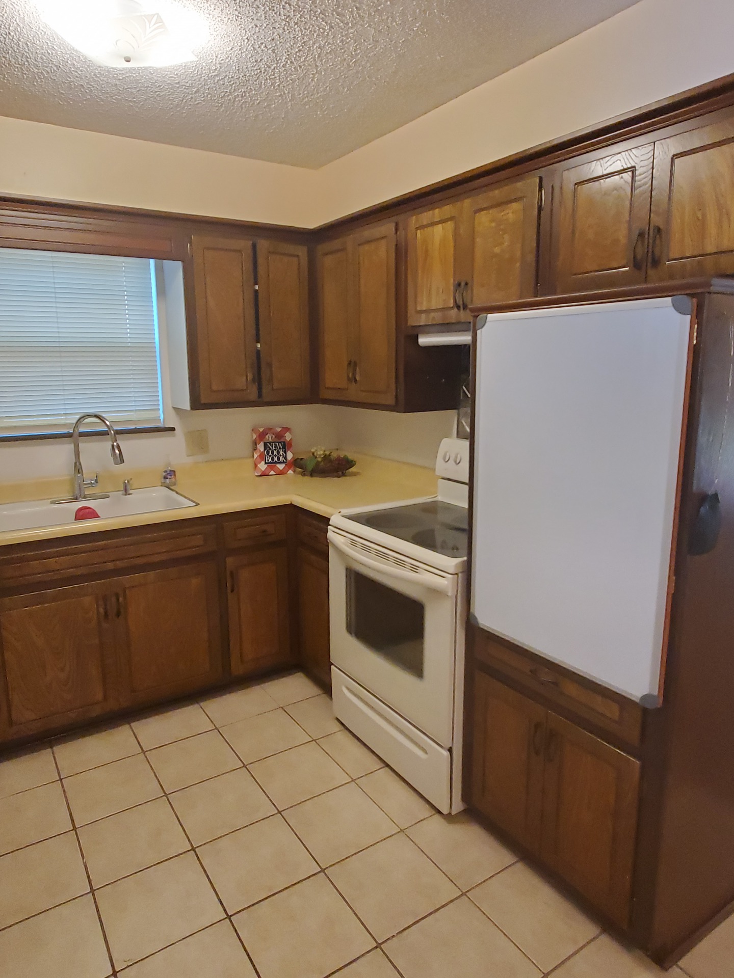 A kitchen with a tile floor