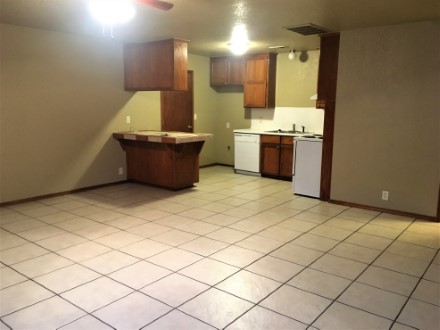 A kitchen with a tile floor