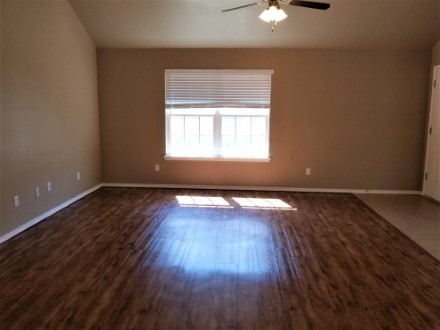 A large room with a wood floor