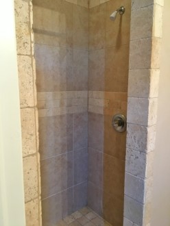 A close up of a shower in a small room
