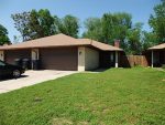 A house with a grass lawn