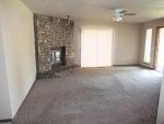 Living room with stone fireplace