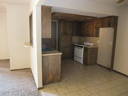 A kitchen with a tile floor