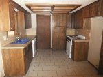 A kitchen with a tile floor