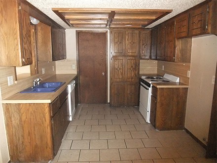 A kitchen with a tile floor