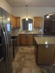 A large kitchen with stainless steel appliances