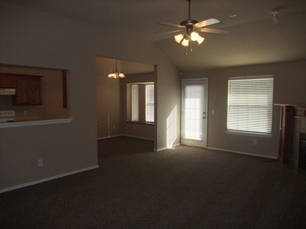 A large living room with ceiling fan