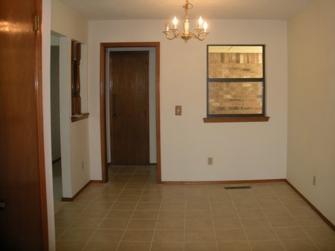 A dining room with tiled flooring