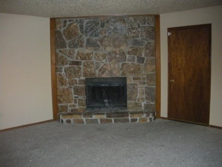 A living room with a fireplace