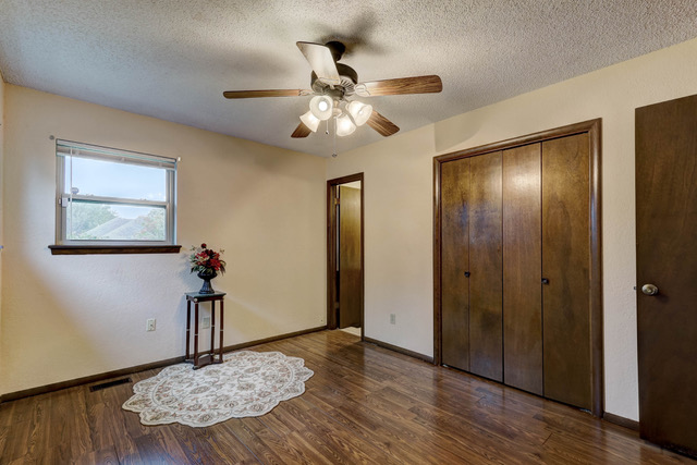 A living room filled with furniture and a large window