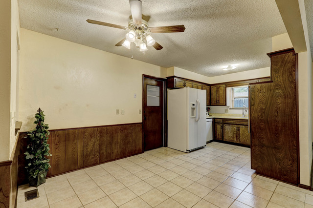 A kitchen with a tile floor