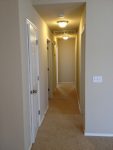 A hallway with carpet on the floor
